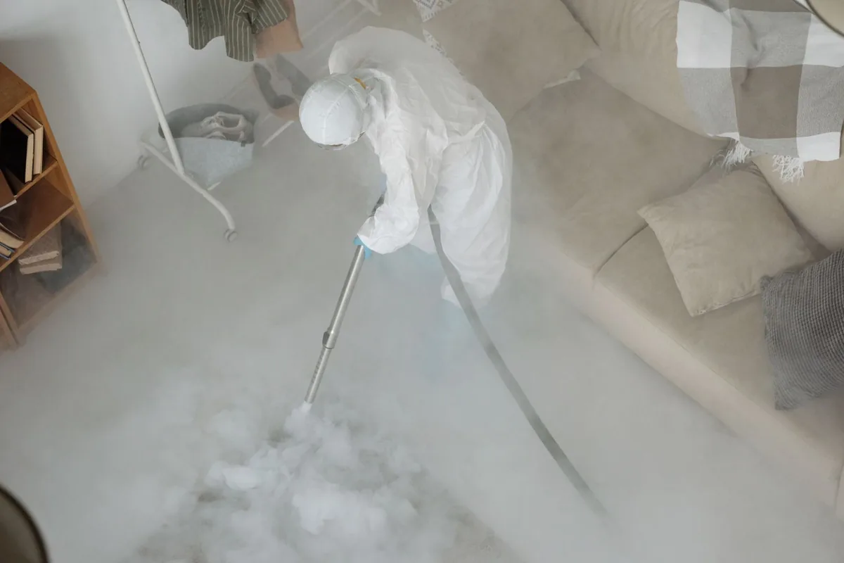 Biohazard cleanup technician in protective equipment, East Prairie, MO
